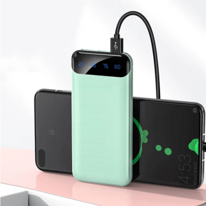 Portable power bank charging two smartphones, displaying battery levels on its LED screen